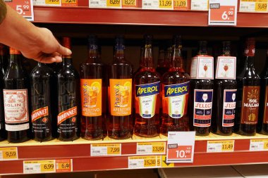 NETHERLANDS - APRIL 2022: Bottles Apritifs and digestifs, alcoholic beverages in a wholesale.