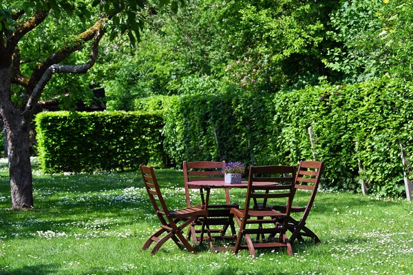 Garden furniture in an Orchard during springtime