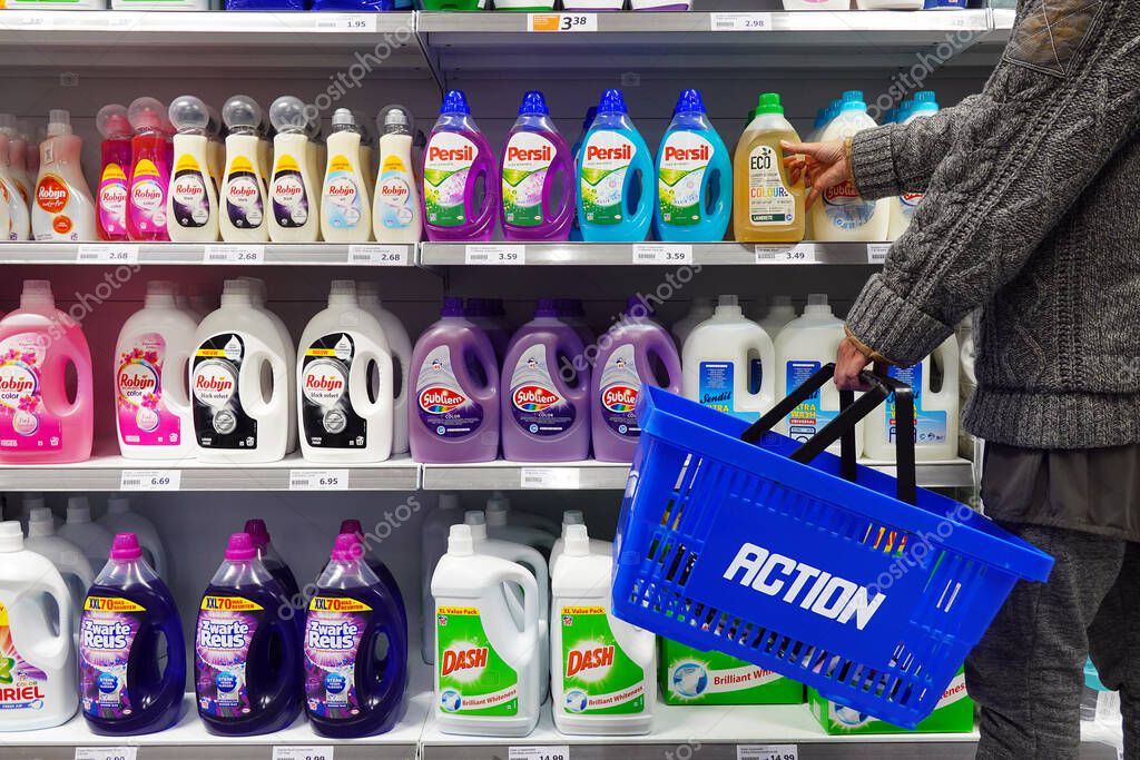 NETHERLANDS - MAY 2022: Customer buys an Ecological detergent in an Action superstore.