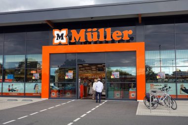 KRANENBURG, GERMANY - JULY 2022: Entrance of a Mller store. Muller is primarily a cosmetics store with large drugstore and perfumery section.