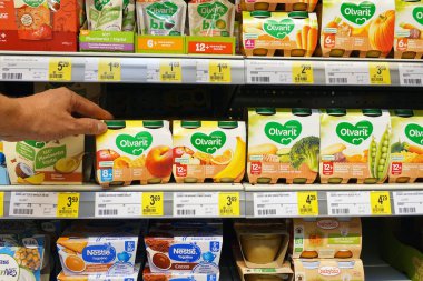 WALLONIA, BELGIUM - AUGUST 2022: Olvarit brand food for toddlers in a Delhaize supermarket. Olvarit is a brandname of Nutricia owned by Danone.