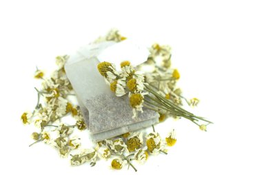 Bag of chamomile tea on white background clipart