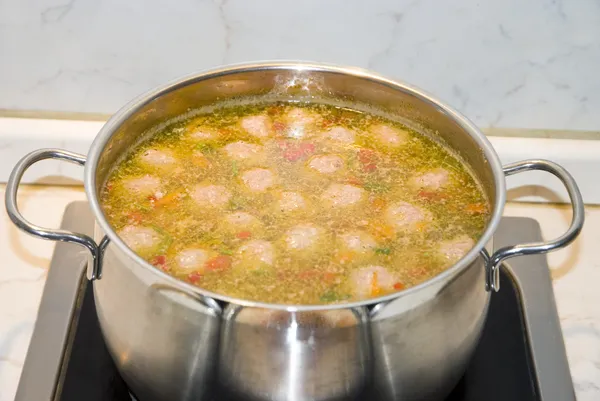 Soup with meatballs in pan — Stock Photo, Image