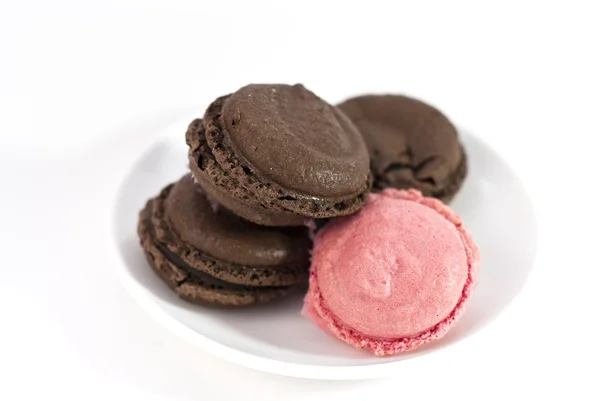 Macaroons in brown and pink tone on white background — Stock Photo, Image