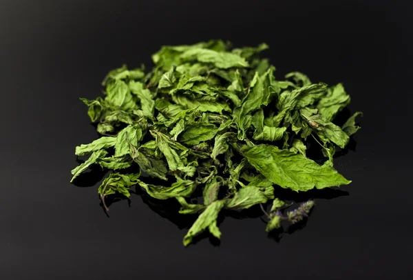 Dried mint on black background — Stock Photo, Image