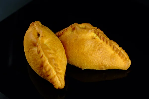 RUSSIAN PIES ON BLACK BACKGROUND — Stock Photo, Image