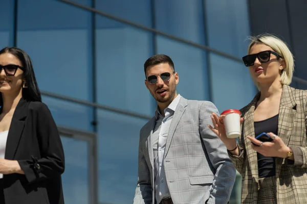 Three Urban Business People Walking Talking While Drinking Coffee — Stock Photo, Image