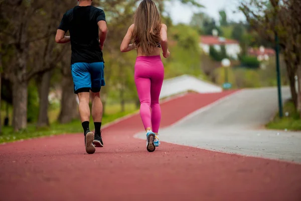 Beautiful Woman Smiling While Jogging Boyfriend Running Track Park — Stock Photo, Image
