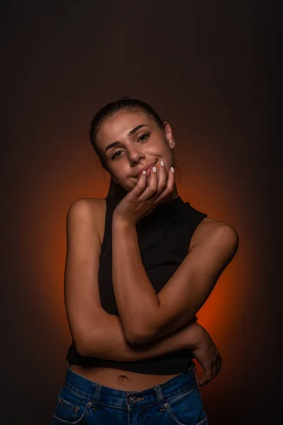 Attractive Beautiful Girl Smiling While Posing Studio Orange Light — Stockfoto