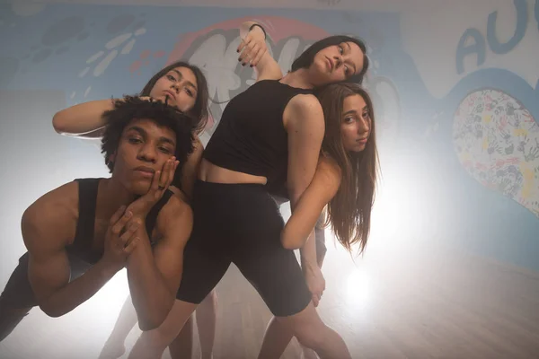 Group of multiracial dancers are exercising and practicing in their studio in slow motion