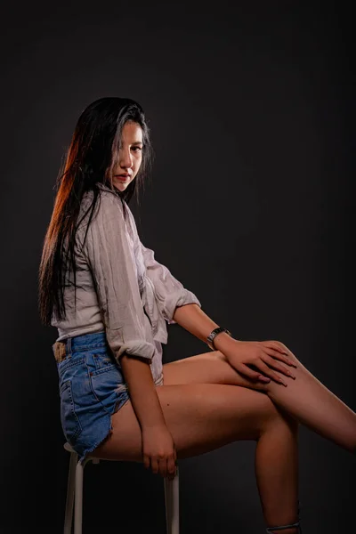 Attractive Beautiful Girl Sitting White Chair Studio While Posing Touching — Stok fotoğraf