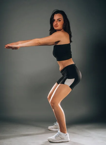 Beautiful Caucasian Slim Woman Doing Stretching Training Dark Modern Studio — Stock Photo, Image