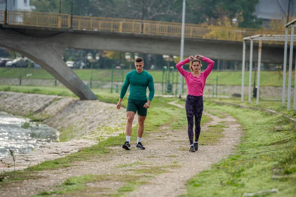 Attractive Strong Friends Taking Break While Walking River — Stock fotografie