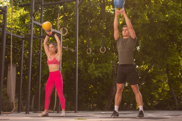 Couple Training While Lifting Weight Together — Stock Fotó