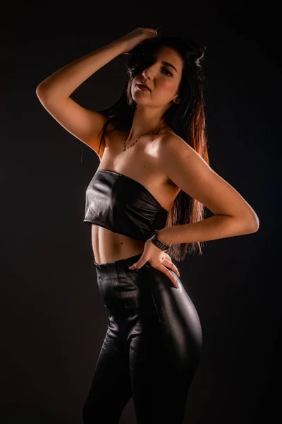 Attractive Girl Posing Studio While Touching Her Hair Holding Her — стоковое фото