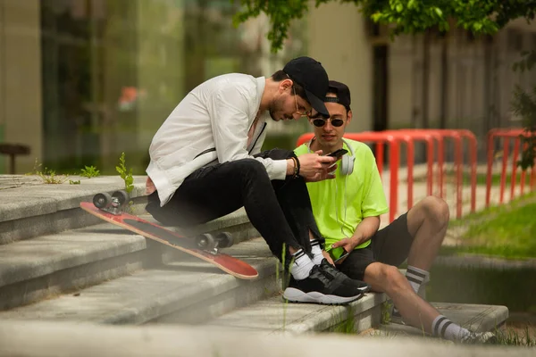 Two Guy Friends Sitting Stairs While Looking Selfies Them Both — 图库照片