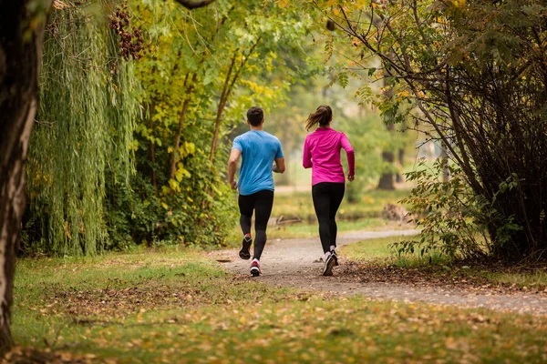 Attractive Sportive Couple Running Together Park Trees — ストック写真