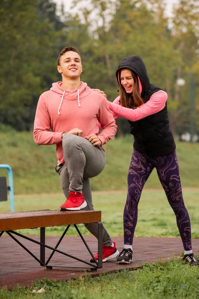 Attractive Amazing Friends Stretching Together Bench While Laughing — Fotografia de Stock