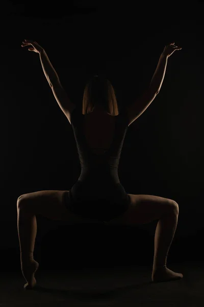 Young Ballerina Doing Squat Pose Her Arms High One Foot — Fotografia de Stock