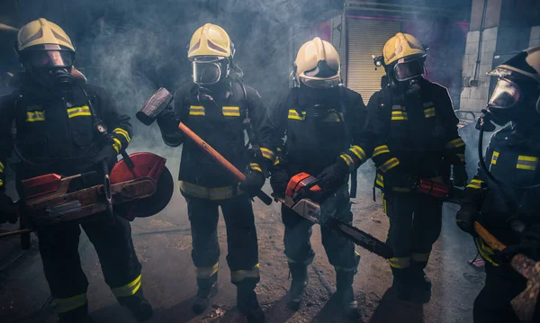 Group Firefighters Chainsaw Sledge Hammer Practicing Garage Fire Department — Stock Photo, Image