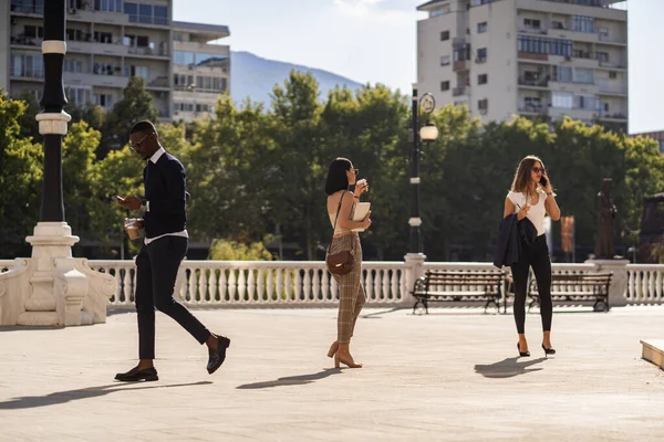 Three Multiracial Young Business People Hurry Work — Stockfoto