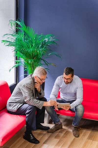 Two Senior Businessmen Sitting Looking Plans Ideas Tablet —  Fotos de Stock