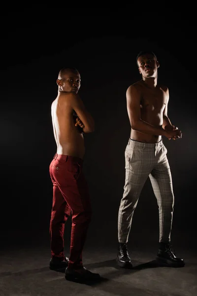 stock image two black males are doing two diffrent poses in studio