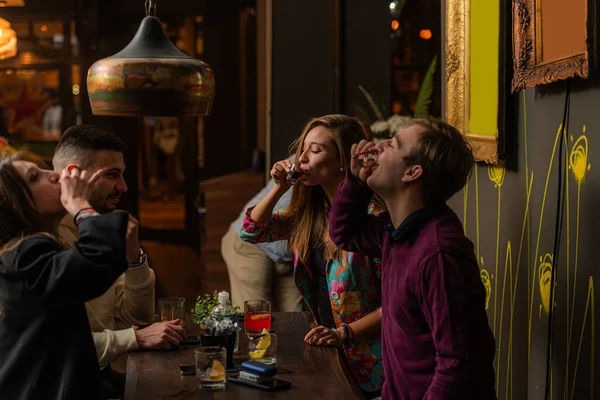 Two Amazing Attractive Couples Drinking Shots Together While Having Fun — Stock Photo, Image