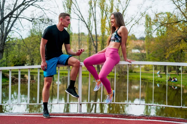 stock image Sport motivation and healthy fitness lifestyle. Young couple of runners resting during outdoor morning workout