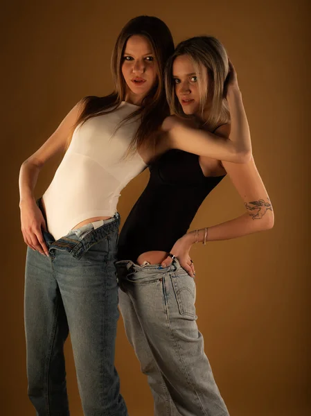 Two Amazing Attractive Girl Friends Posing Cool Together Studio Yellow — Stock Photo, Image