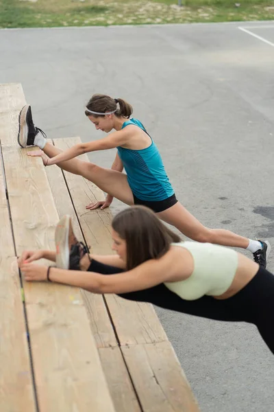 Both Attractive Beautiful Girls Stretching While One Them Doing Oversplit — Stock Photo, Image