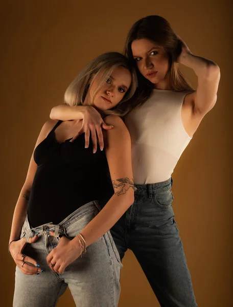 Two Amazing Attractive Girl Friends Posing Together Studio Yellow Background — ストック写真