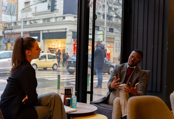Two Multiracial Business People Having Discussion — Stock fotografie