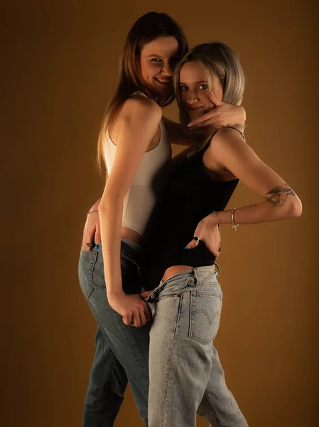 Two Amazing Attractive Girl Friends Posing Cool Together Studio Yellow — Foto de Stock