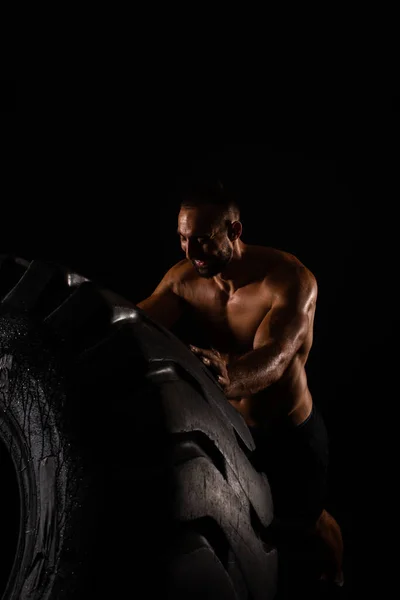 Handsome Topless Guy Smiling While Lifitng Big Training Tire — Stock Photo, Image