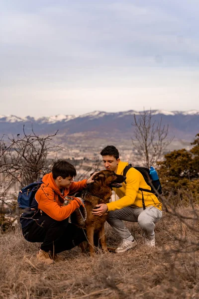 Attractive Handsome Male Friends Petting Dog — Stockfoto