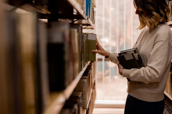 Close Girl Taking Book Bookshelvesin Library — Stockfoto