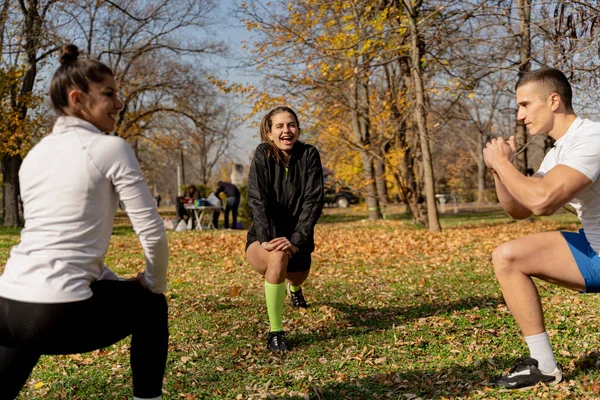 Three Attractive Amazing Fit Friends Stretching Smiling Together — Stock fotografie