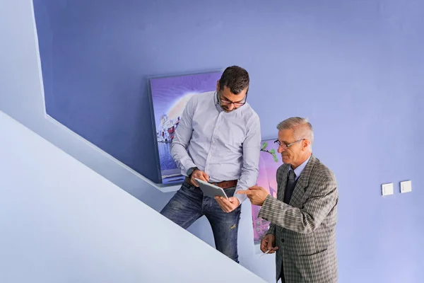 Two Senior Businessmen Standing Stairs Looking — Stock Fotó