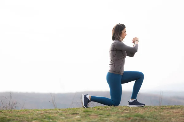 Amazing Active Woman Doing Some Side Squats Exercise — стоковое фото