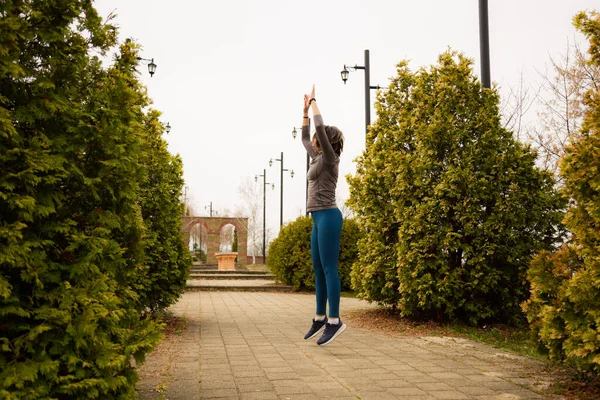 Middle Aged Woman Jumping Park — Stock Photo, Image