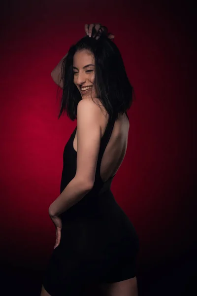 Attractive Seductive Girl Smiling Set While Posing Red Background — ストック写真