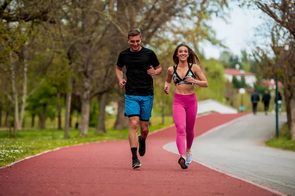 Young Couple Fit Sportsmen Boy Girl Running While Doing Exercise — Foto de Stock