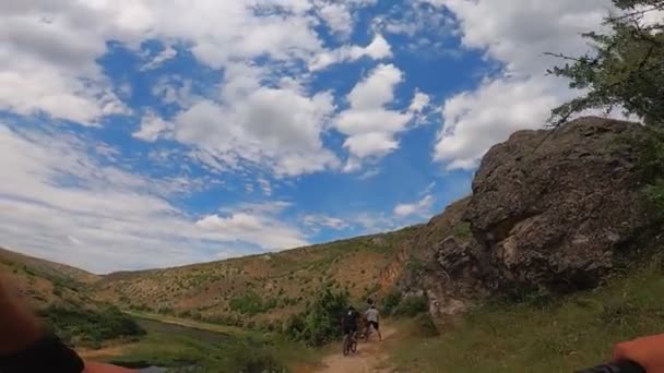 Group People Cycling Together River Canyon Road Summertime First Person — Stock Video