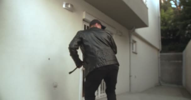 Thief Opening Metal Door Crowbar Entering — Stockvideo