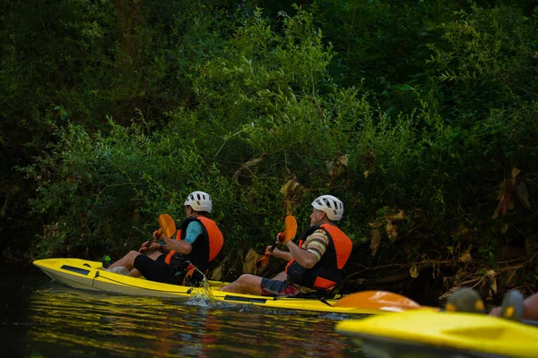 Two Senior Kayakers Kayaking Together While Having Great Time —  Fotos de Stock