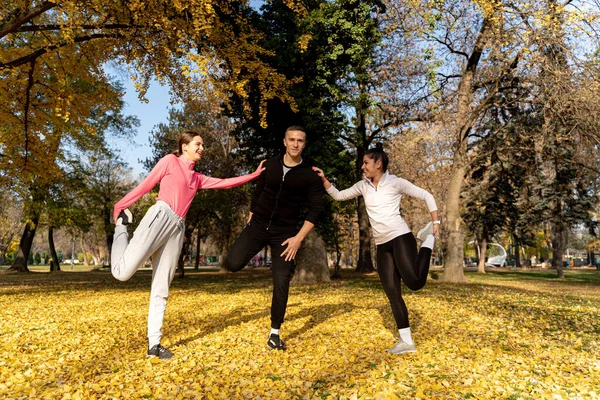 Three Amazing Attractive Friends Stretching Together Smiling Park — ストック写真