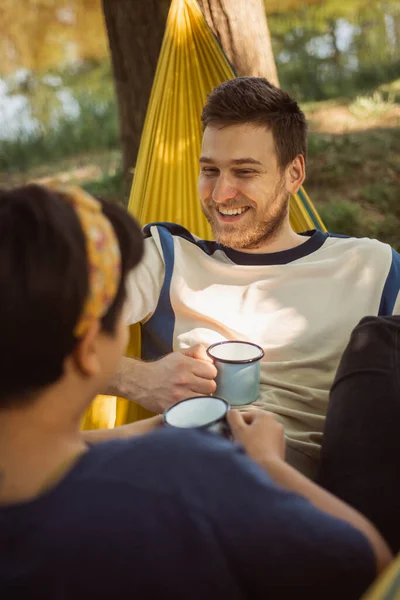 Close Pretty Couple Having Coffee Relaxing Yellow Hammock Park — Stockfoto