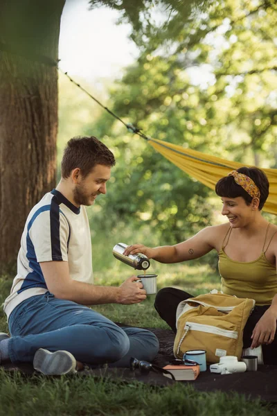 Pretty Couple Sitting Picnic Girl Pouring Coffee Boys Cup — Stockfoto
