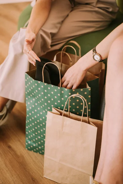 Details Girls Sitting Sofa Mall Looking Shopping Bags — Photo